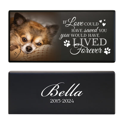 A black wooden pet urn for a pet with pawprints design and a heartfelt quote.