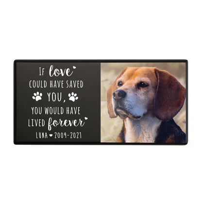 A black wooden pet urn for a pet with paw prints design and a heartfelt quote.