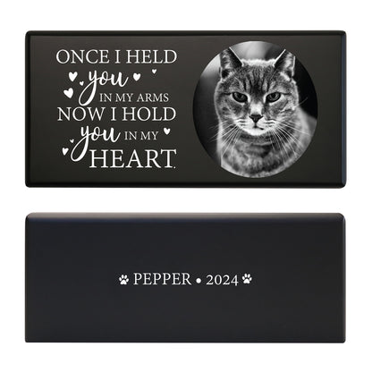 A black pet cremation urn featuring a cat photo and a touching memorial quote.