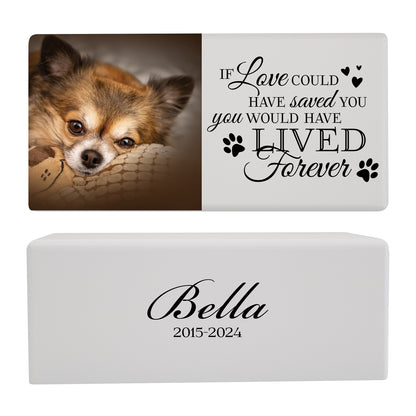 A white wooden pet urn for a pet with pawprints design and a heartfelt quote.