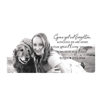 A personalized pet cremation urn with a woman lovingly hugs her dog in a memorial photo with a heartfelt tribute.
